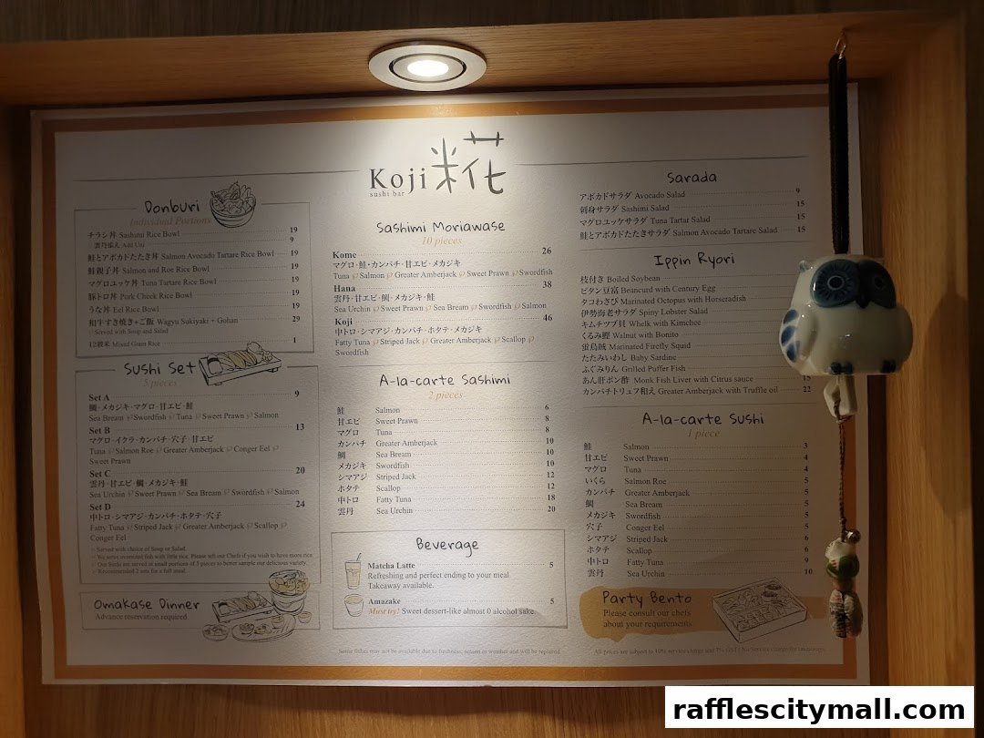 A menu for Koji Sushi Bar featuring various sushi sets, sashimi, and beverages.