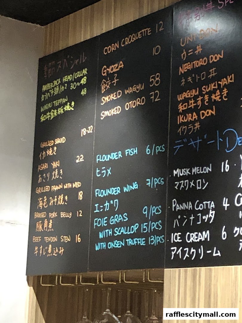 A close-up of a chalk menu board with various Japanese and Western dishes listed.