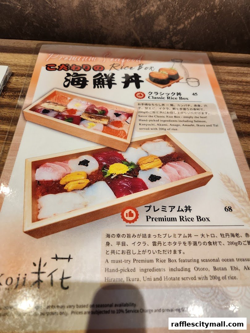 A menu featuring two types of premium seafood rice boxes with detailed descriptions.