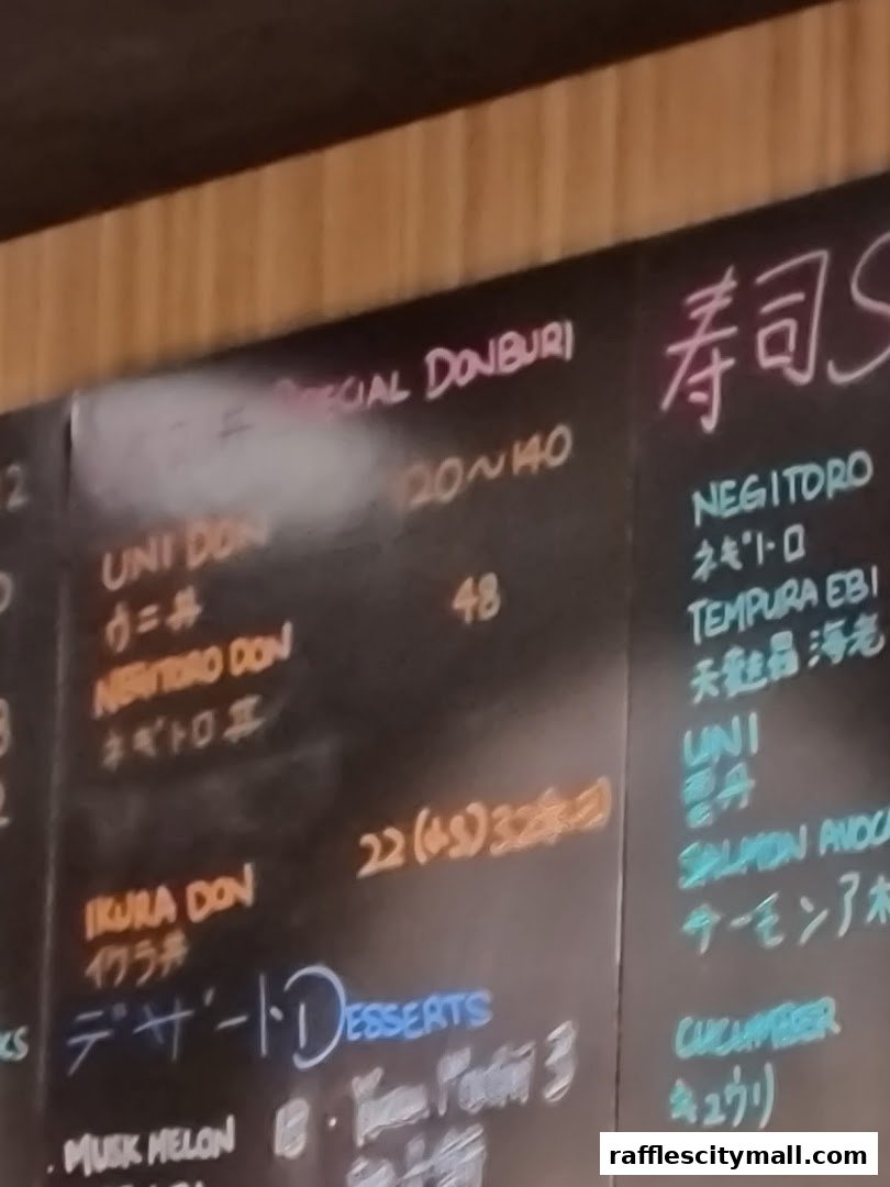 A close-up of a sushi menu board with various Japanese dishes and desserts listed.