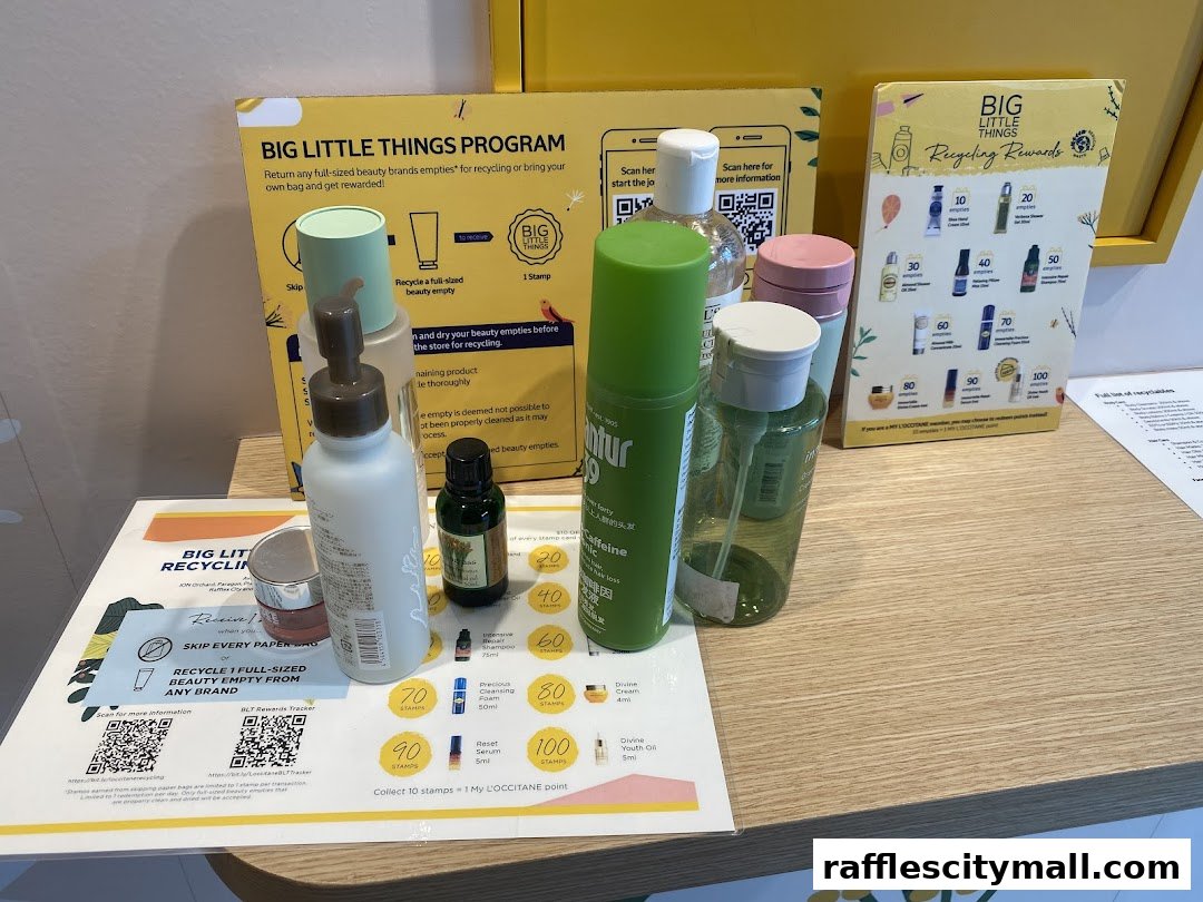 L'Occitane products displayed with a recycling program promotion.