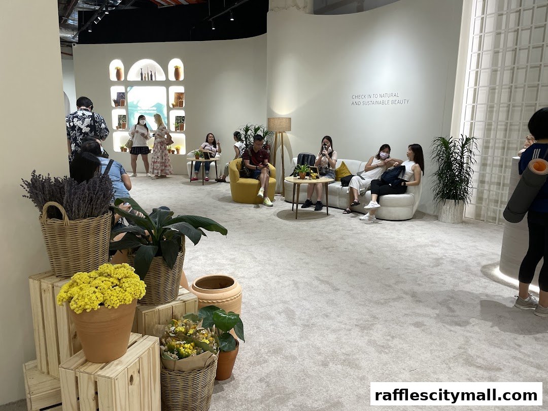 People relaxing in a bright, modern retail space with plants and decorative displays.