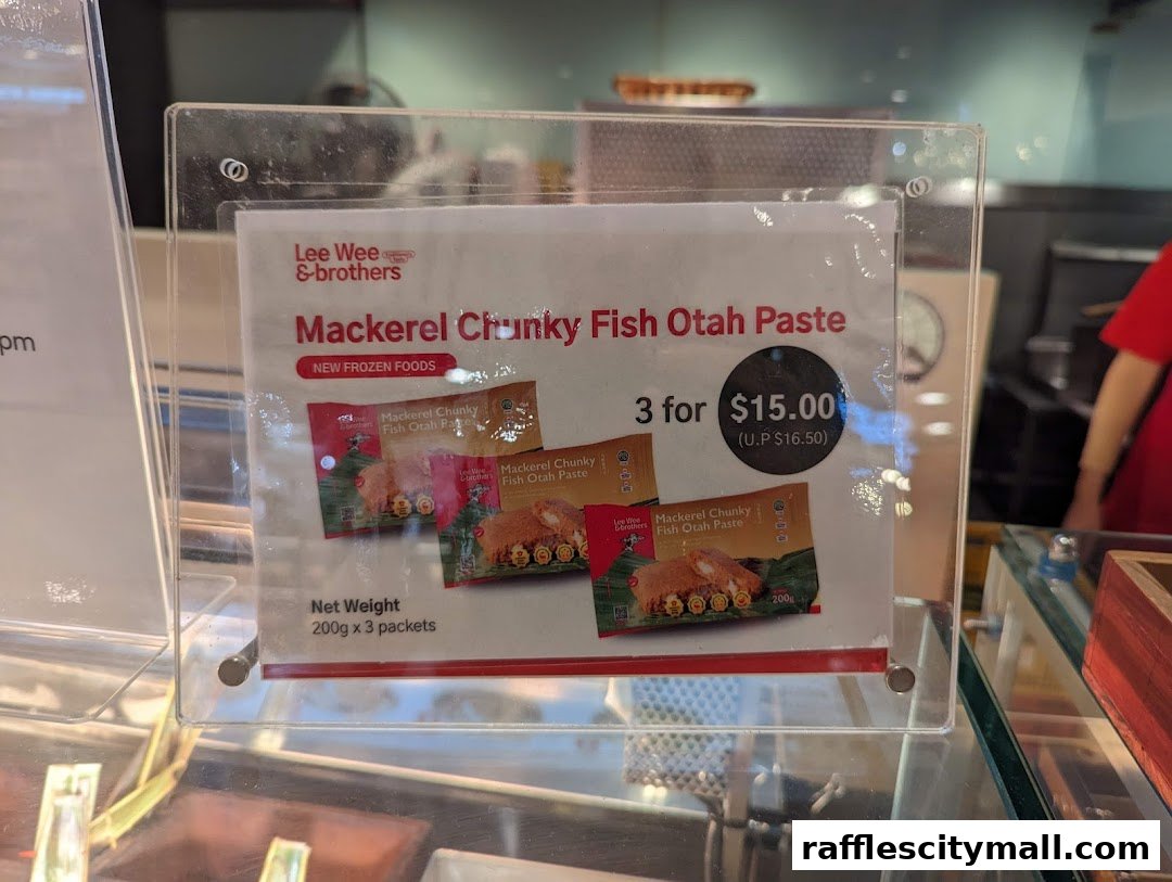 A sign advertising Lee Wee Brothers Mackerel Chunky Fish Otah Paste with a special offer.