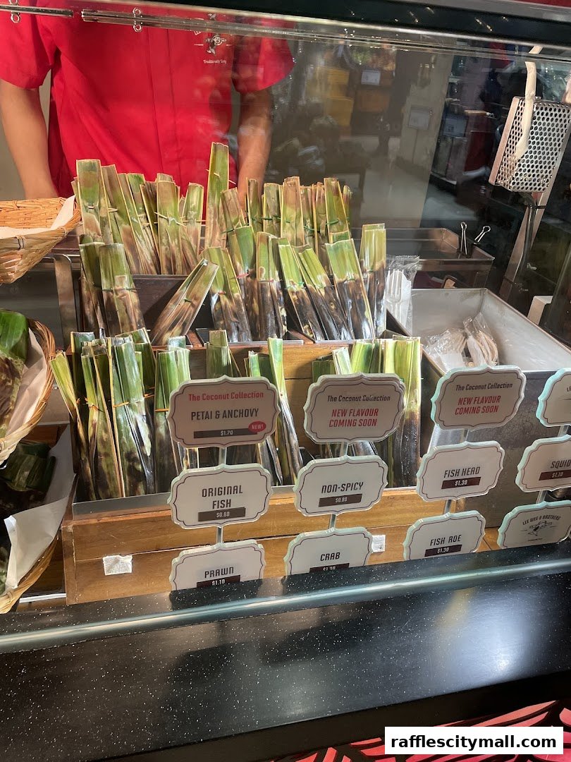 A display of various grilled seafood items wrapped in banana leaves at Lee Wee Brothers.