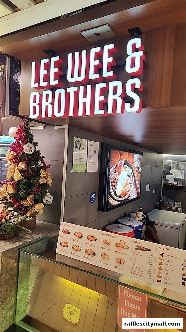 The Lee Wee & Brothers shop front with a festive Christmas tree and a menu display.