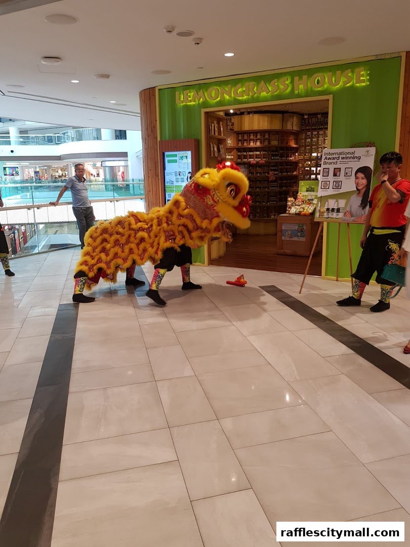 Lion dance performance in front of Lemongrass House shop during a festive event.