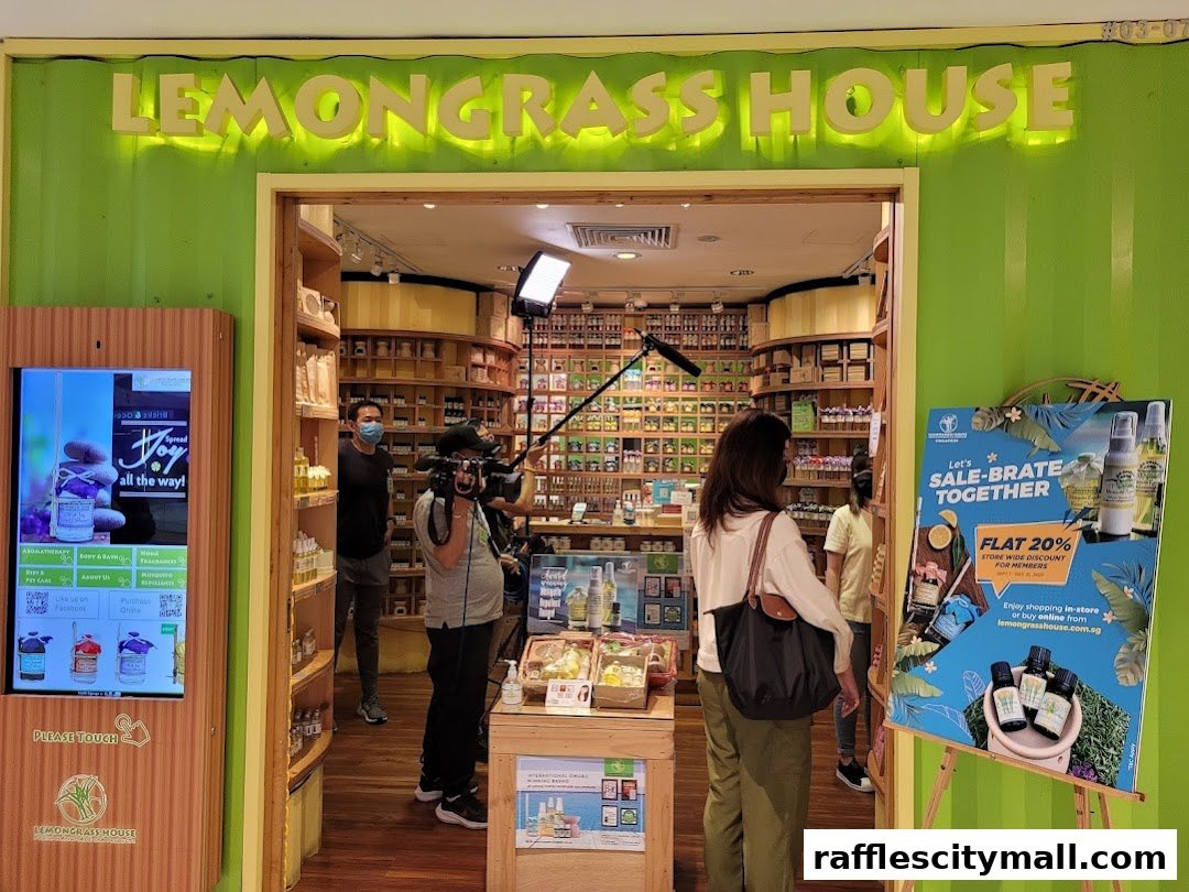 The entrance of Lemongrass House, a shop selling natural products, with a promotional poster and filming crew.