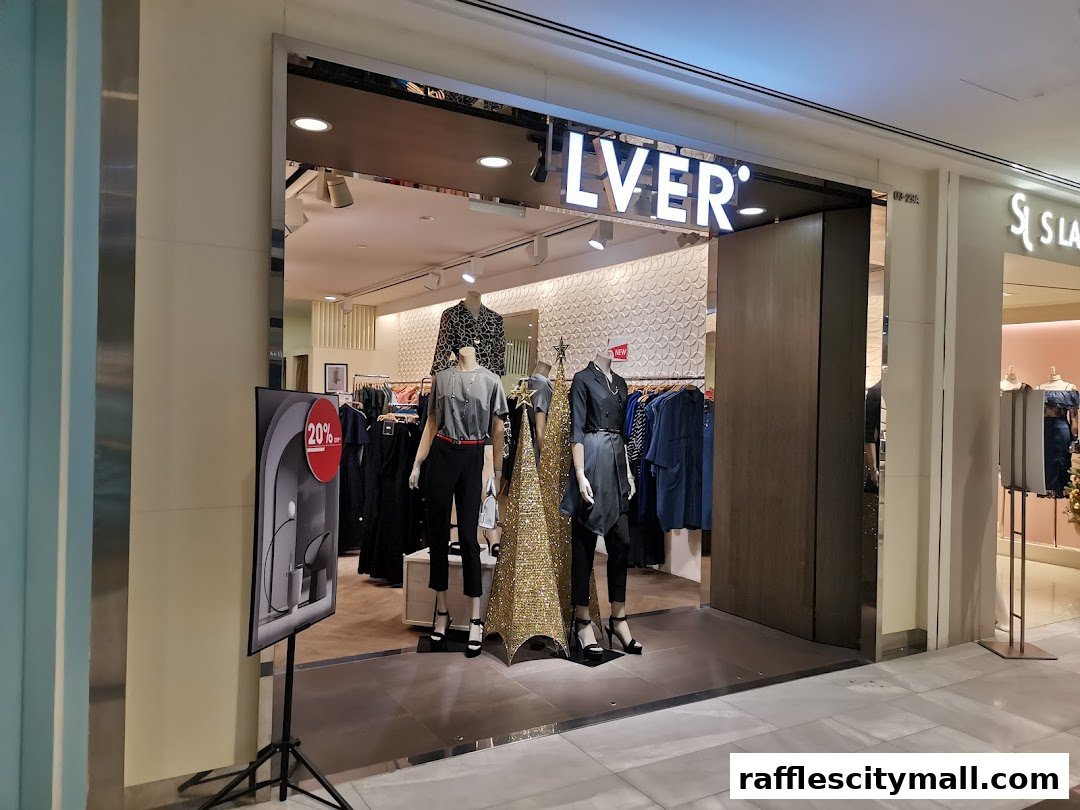 The entrance of a fashion store with mannequins displaying outfits and a 20% off sign.
