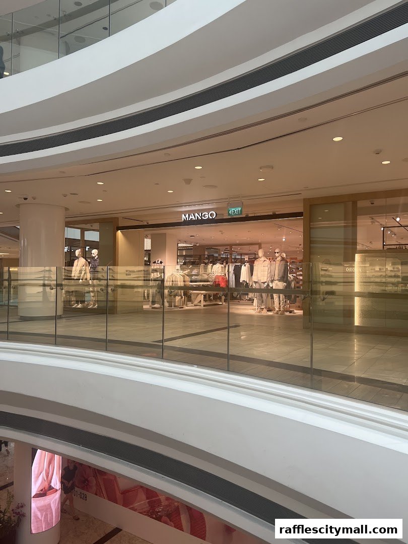 The MANGO store entrance with mannequins displaying clothing inside.