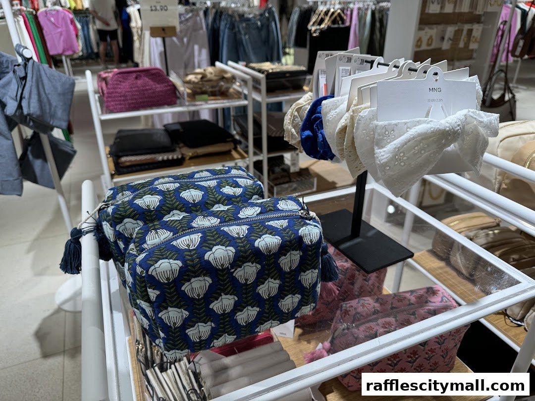 MANGO store interior showcasing patterned cosmetic bags and hair accessories.