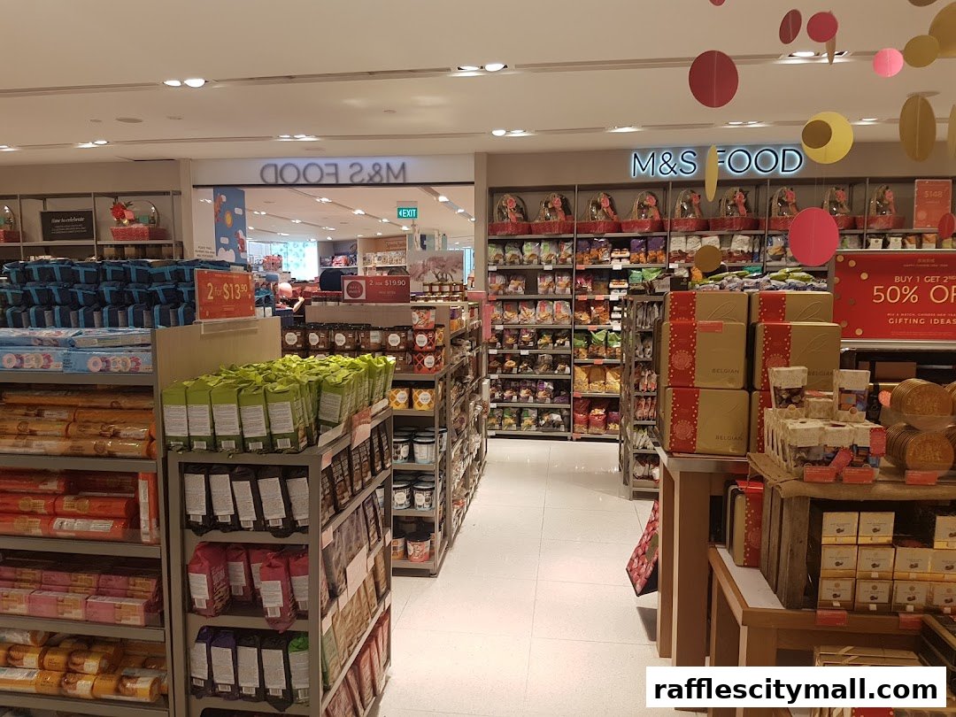 Interior view of a Marks & Spencer Food store with shelves stocked with various food items and gift baskets.