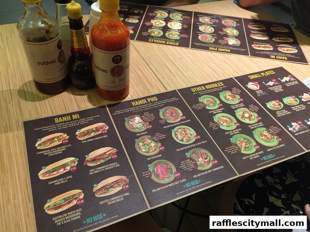 A menu from NamNam Raffles City featuring Vietnamese dishes like Banh Mi and Pho.