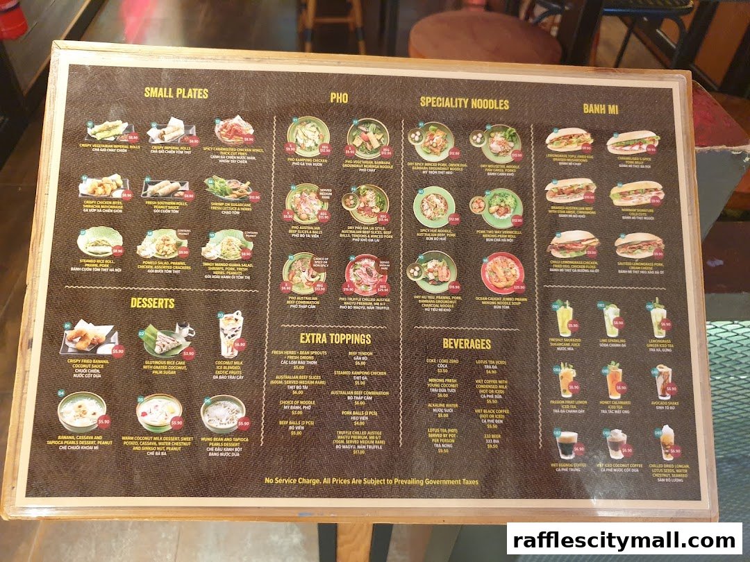 A menu board displaying Vietnamese dishes including small plates, pho, noodles, banh mi, desserts, and beverages.