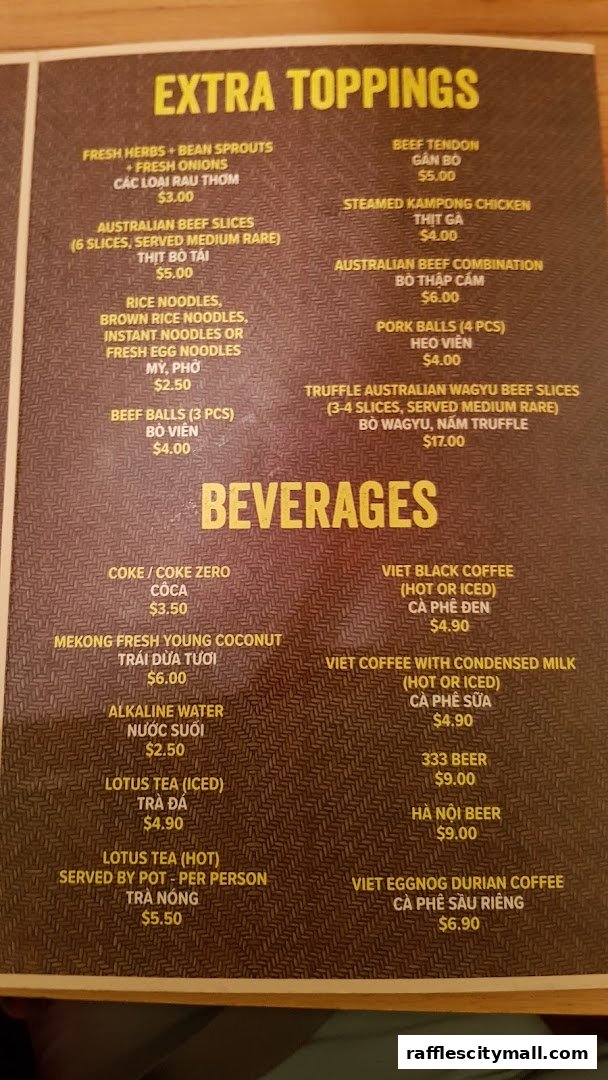 A menu from NamNam Raffles City featuring extra toppings and beverages.