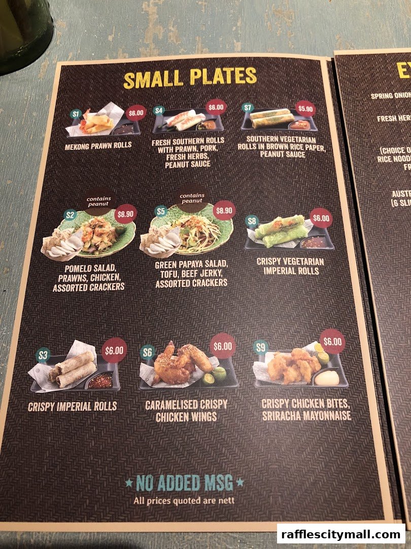 A menu featuring small plates with various Asian-inspired dishes and prices.