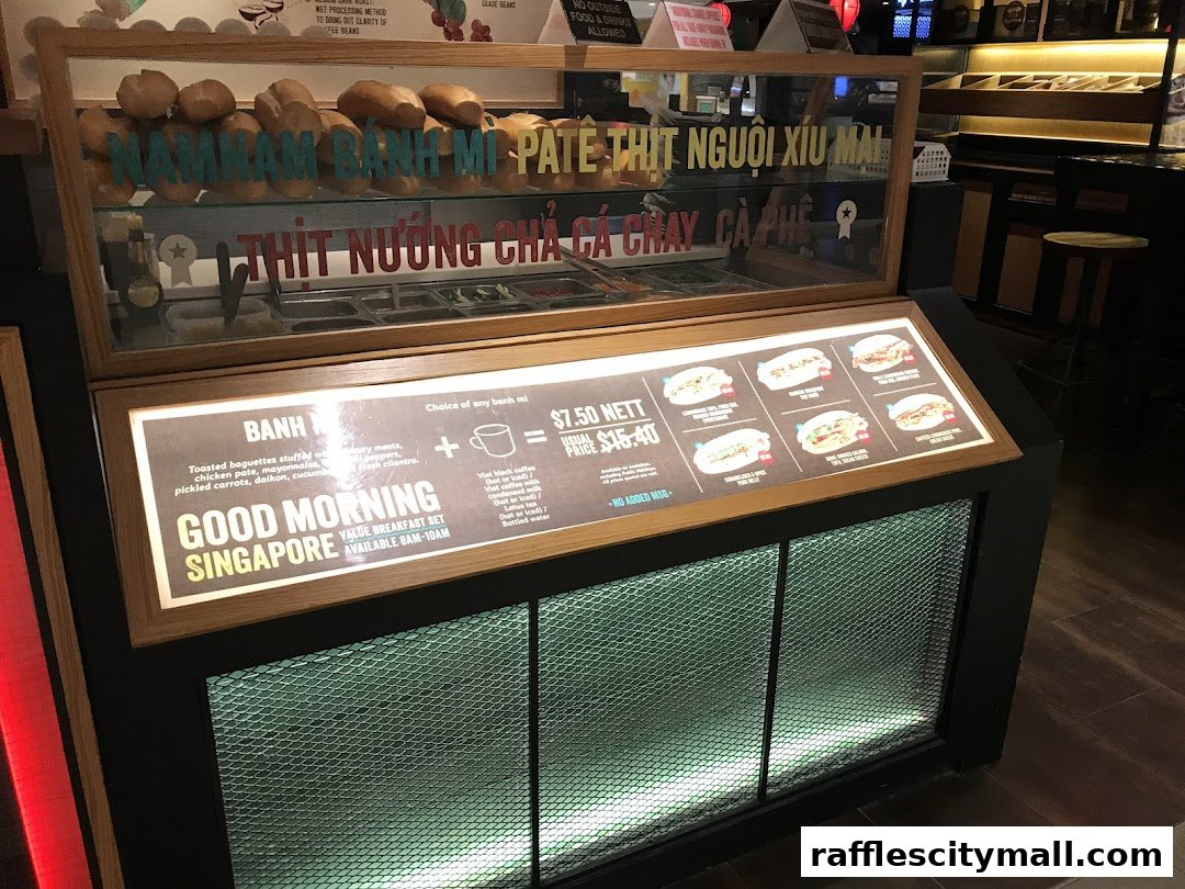 A display case showcasing various banh mi sandwiches and a breakfast set offer.