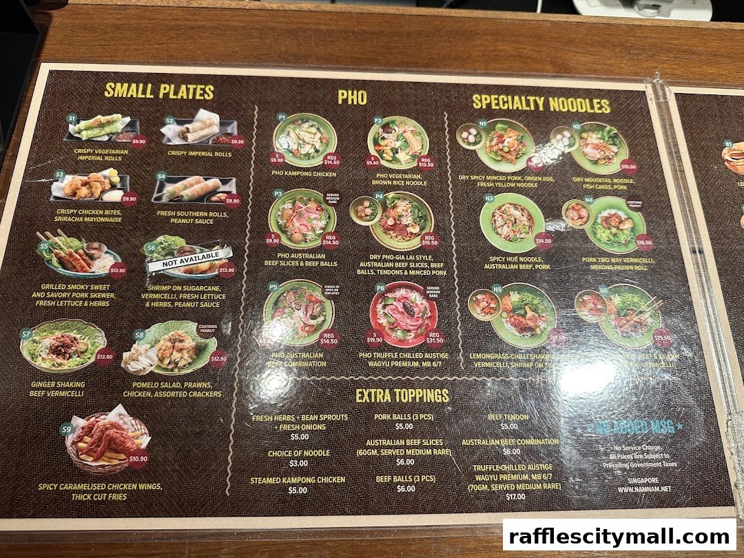 A menu from NamNam Raffles City featuring Vietnamese dishes like Pho, noodles, and small plates.