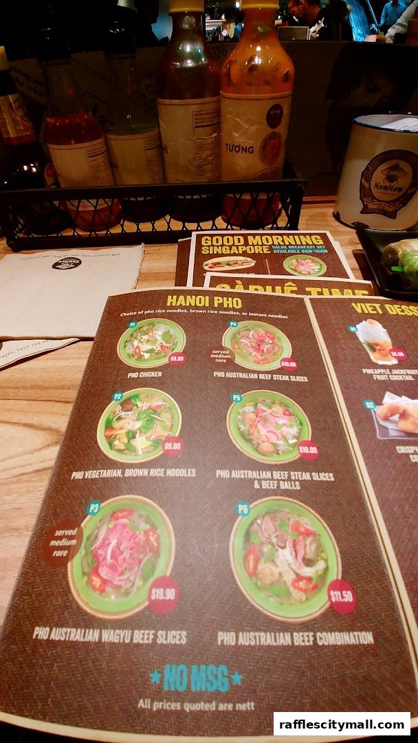A menu from NamNam Raffles City featuring Hanoi Pho and Viet Desserts.