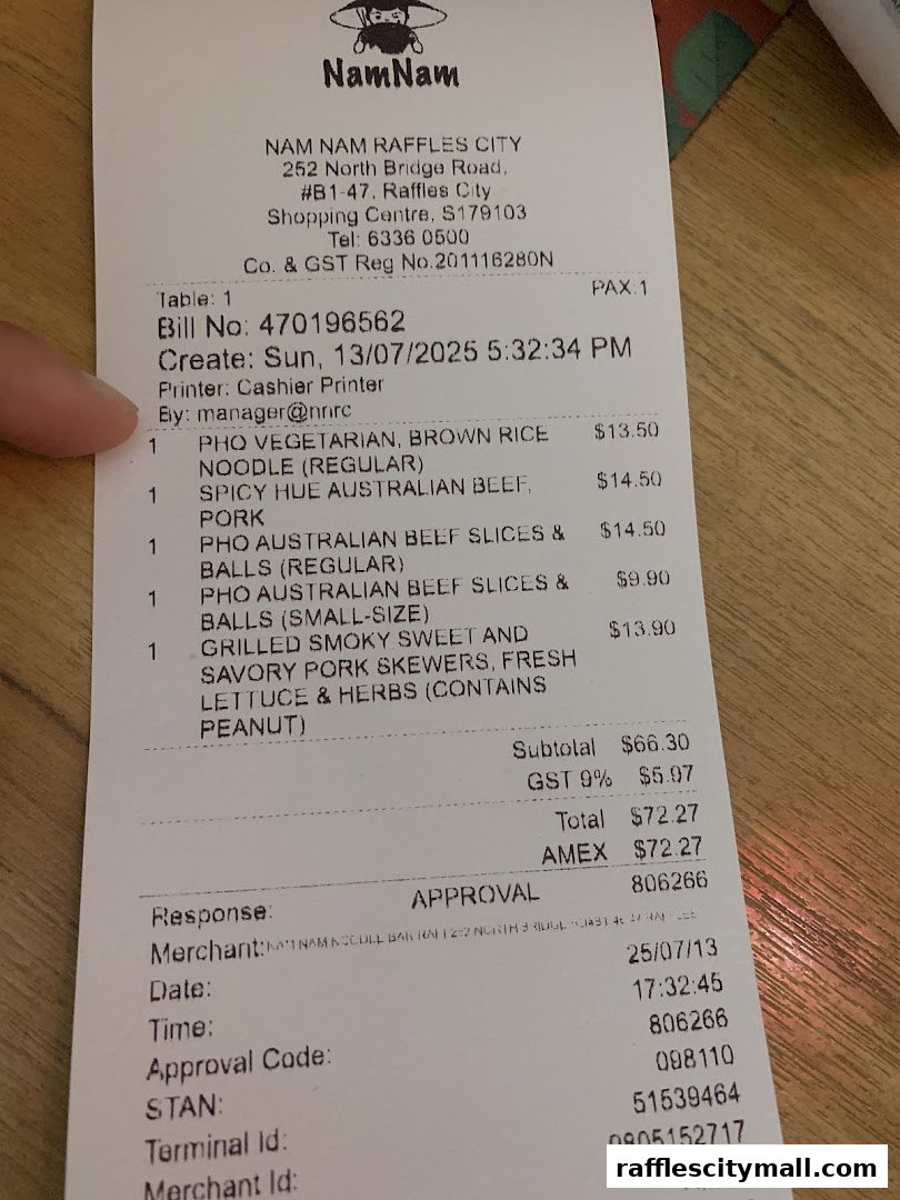 A receipt from NamNam Raffles City showing food items and their prices.