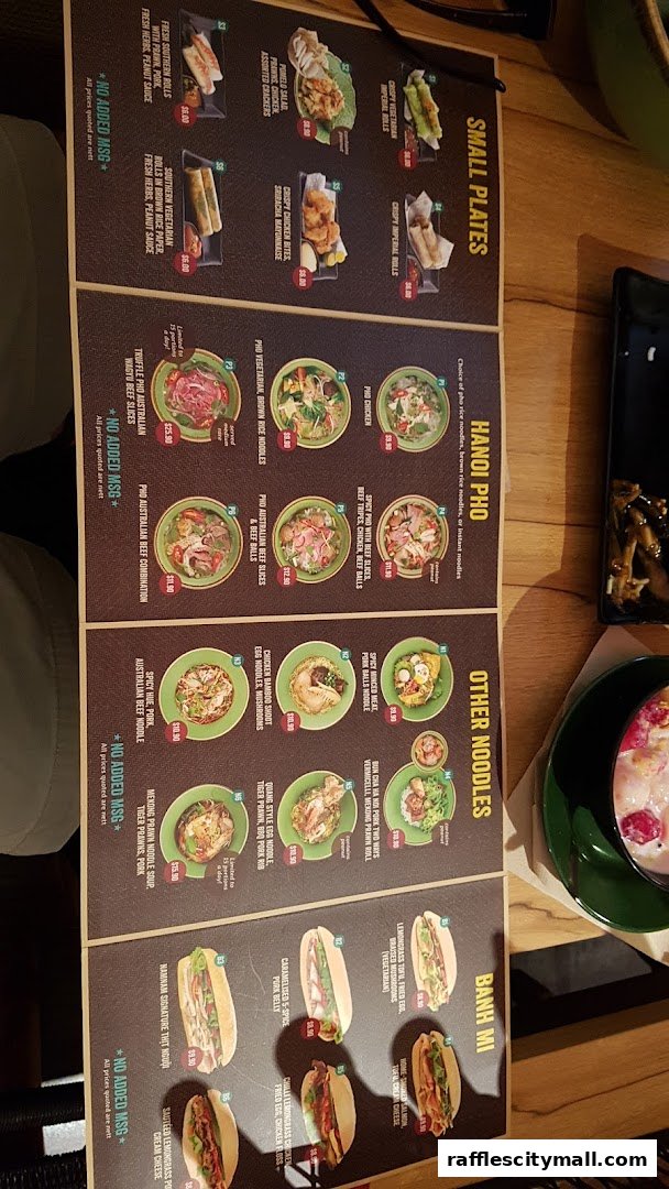 A menu from NamNam Raffles City featuring Vietnamese dishes like pho, banh mi, and small plates.