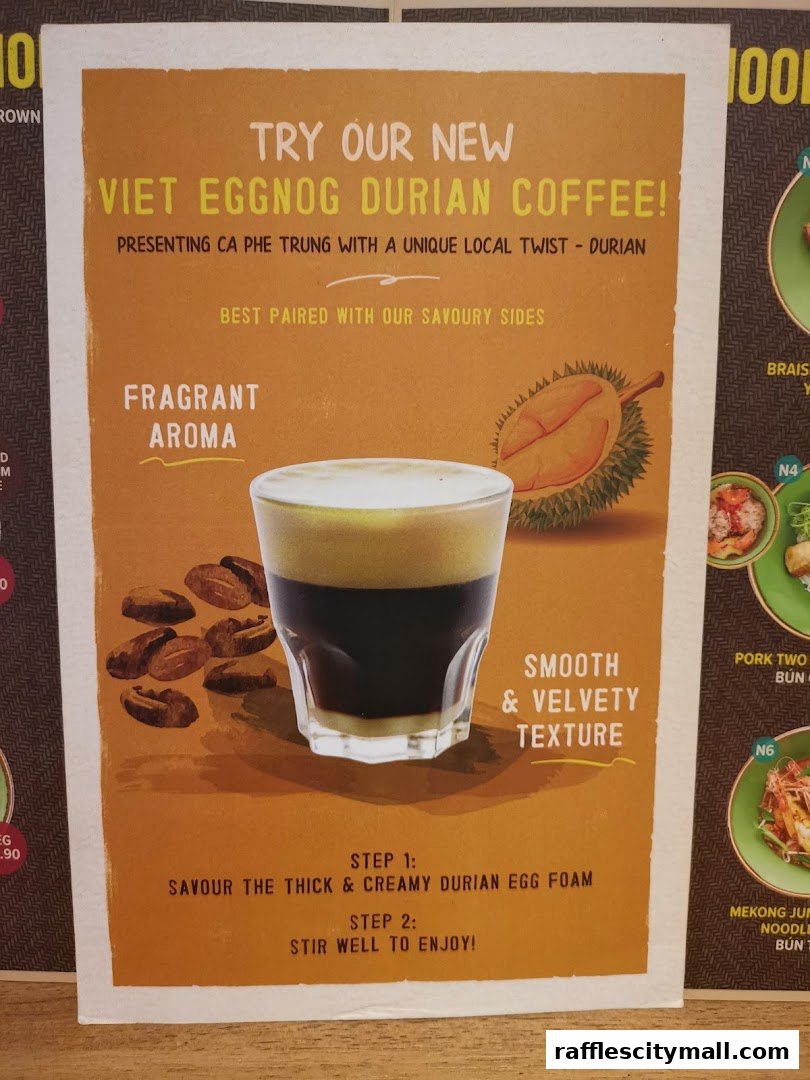 A poster advertising a new Viet Eggnog Durian Coffee with instructions on how to enjoy it.