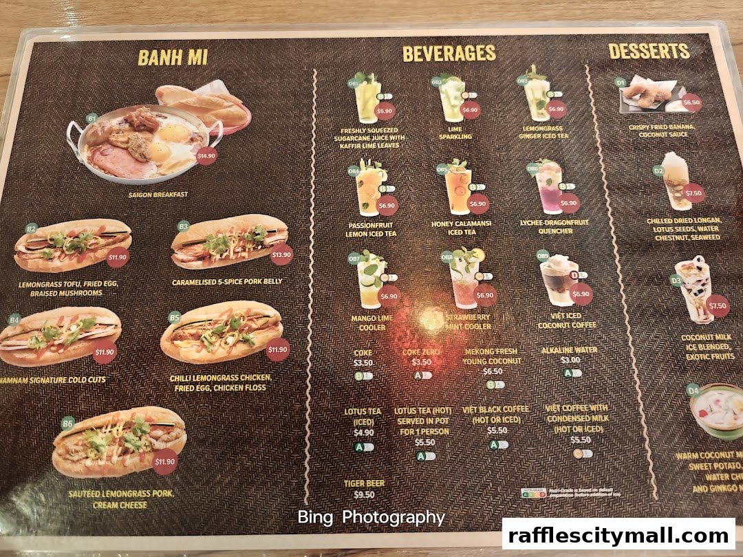A menu from NamNam Raffles City featuring Vietnamese dishes and beverages.