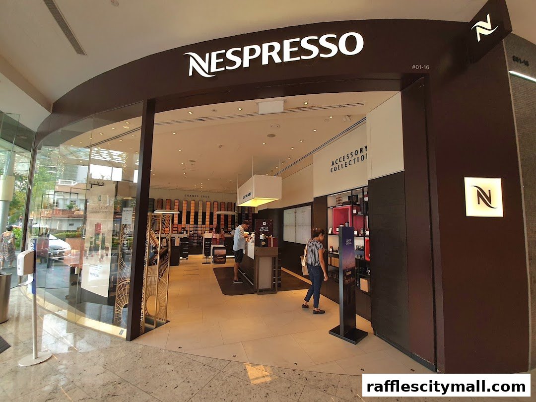 The Nespresso Boutique Raffles City storefront with its iconic branding and interior visible.