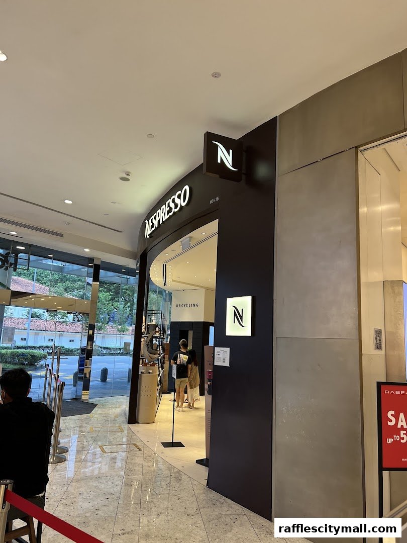 The entrance to a Nespresso Boutique store with its iconic branding and displays visible.