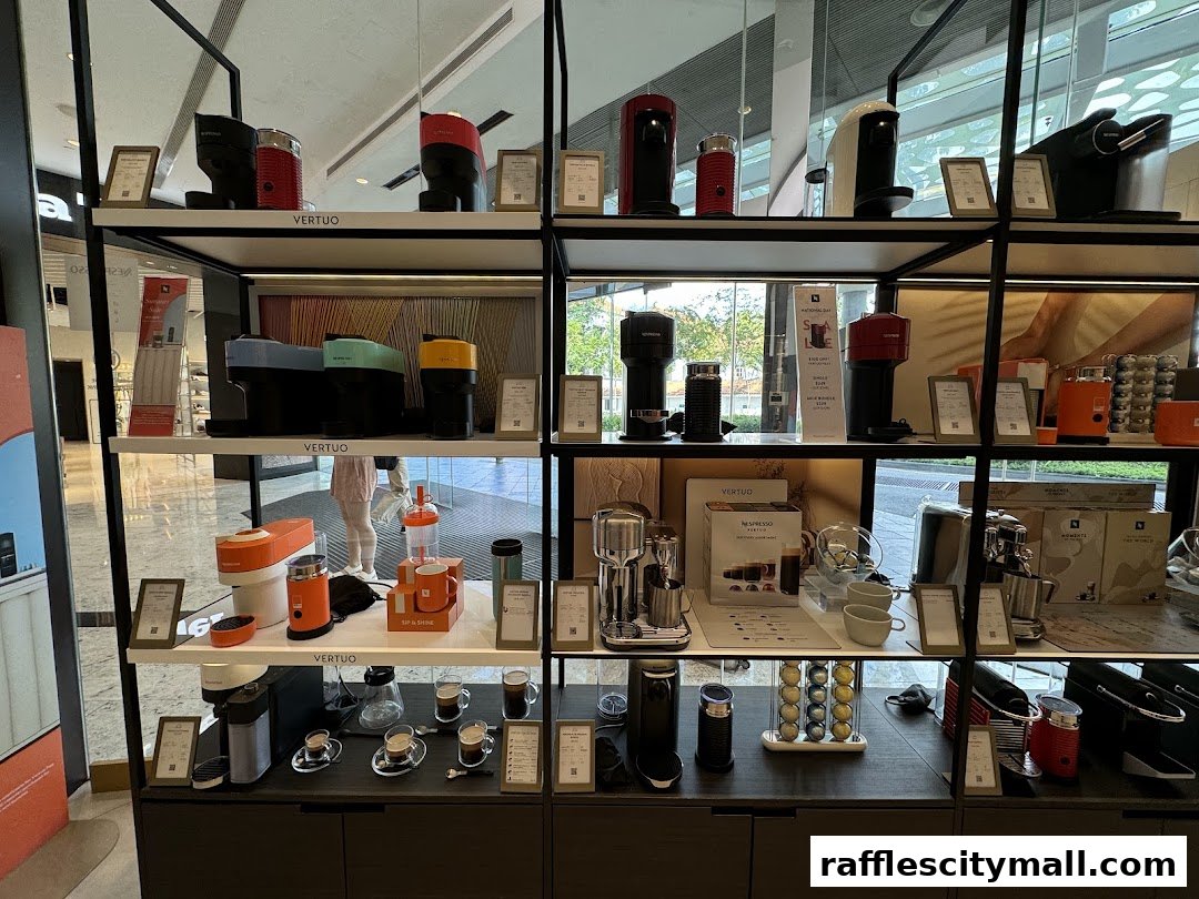 Nespresso coffee machines and accessories displayed on shelves in a retail store.