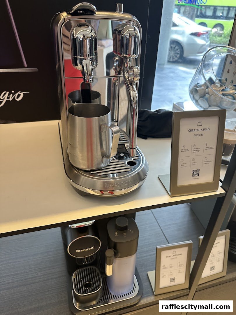 Nespresso coffee machines and capsules displayed on shelves in a retail store.