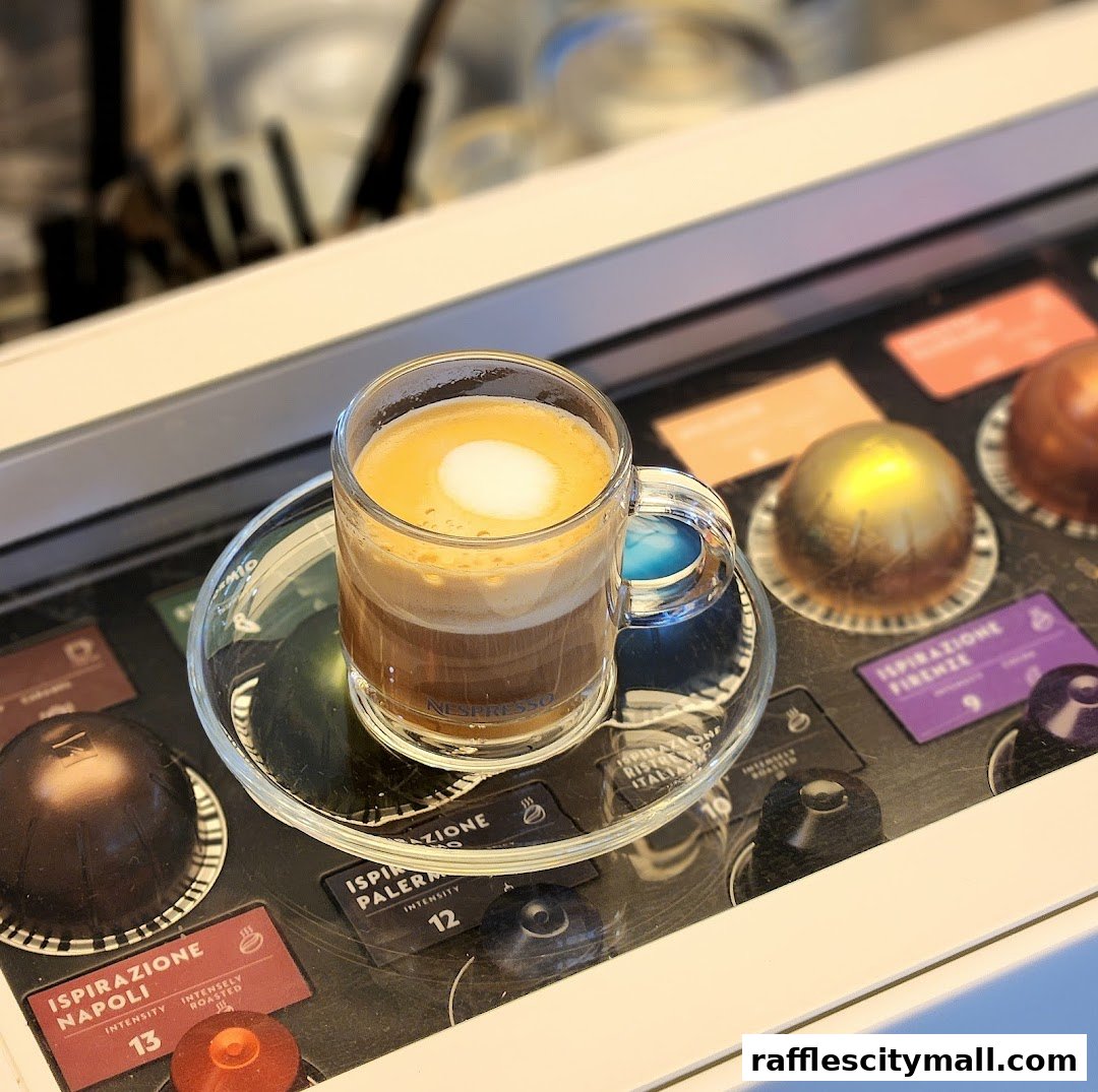 A cup of Nespresso coffee with various coffee capsules displayed.