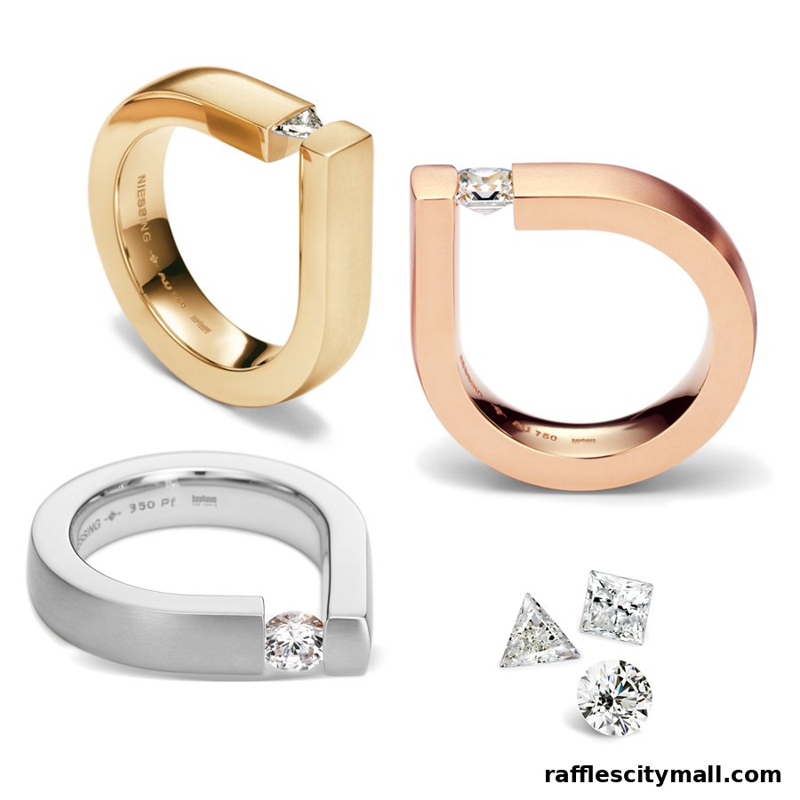 Three modern rings in gold, rose gold, and silver with diamonds, plus loose diamonds.