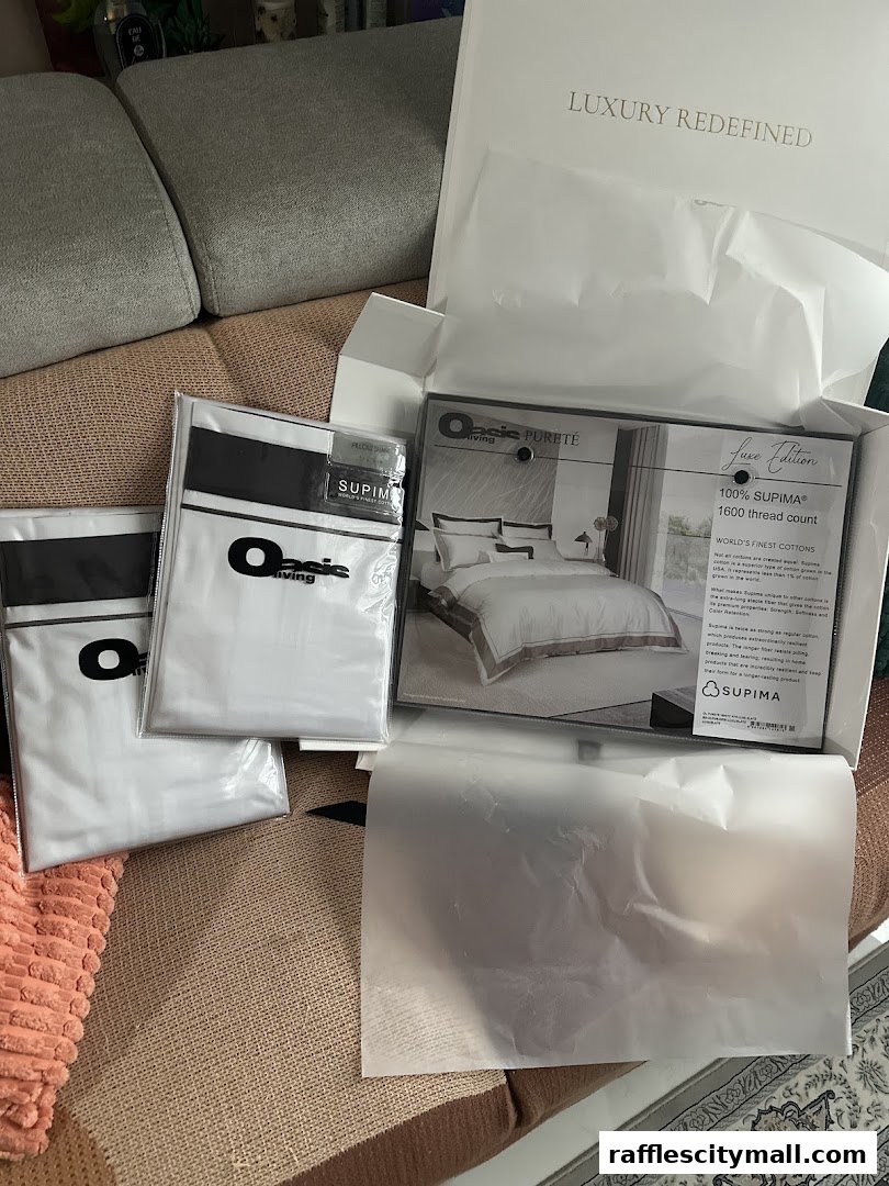 Oasis Living Singapore bedding products, including packaged pillowcases and a duvet cover set.