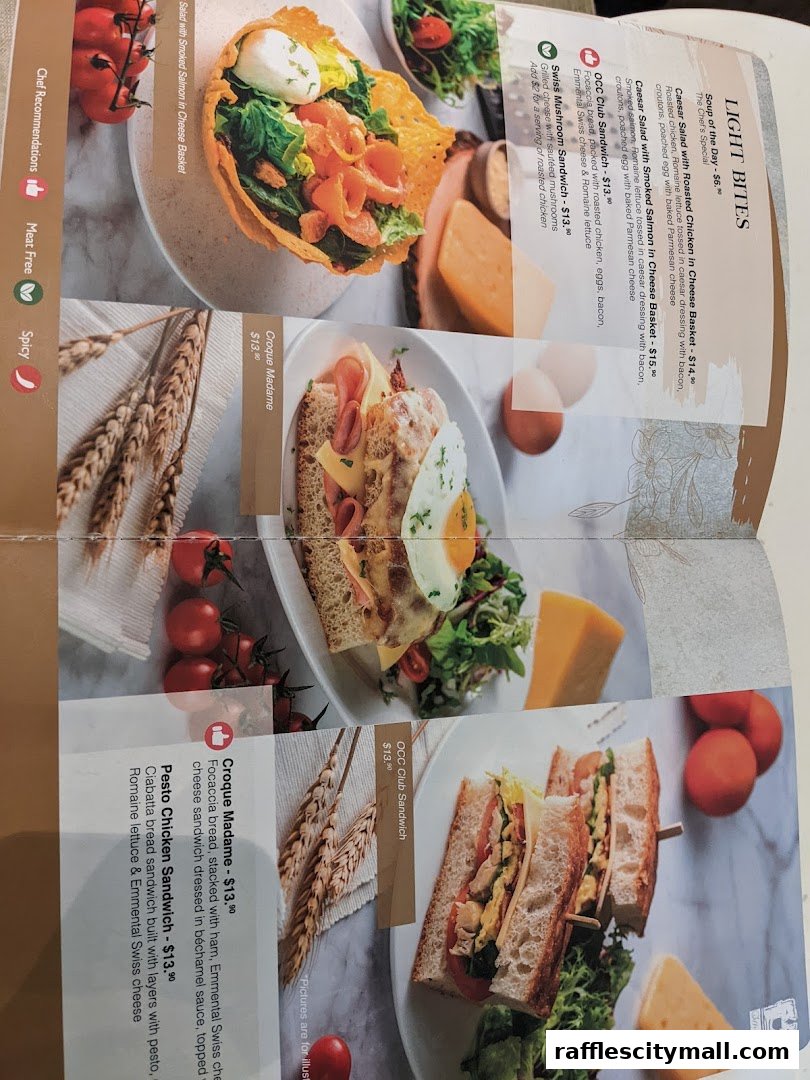 A menu featuring salads, sandwiches, and a Croque Madame with appealing food photography.