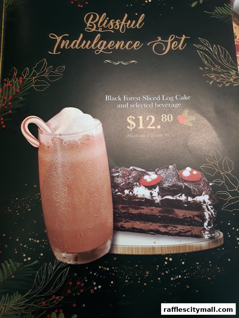 A festive set featuring a Black Forest log cake and a beverage.