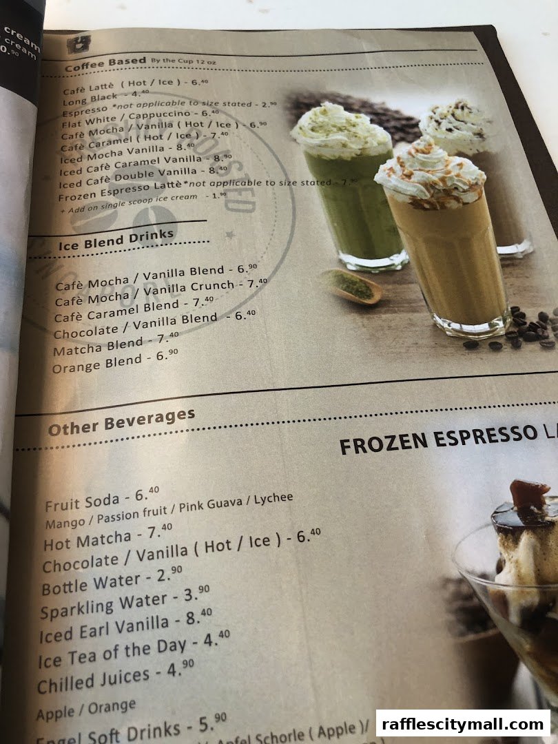 A menu from OCoffee Club Raffles City featuring coffee, ice blend drinks, and other beverages.