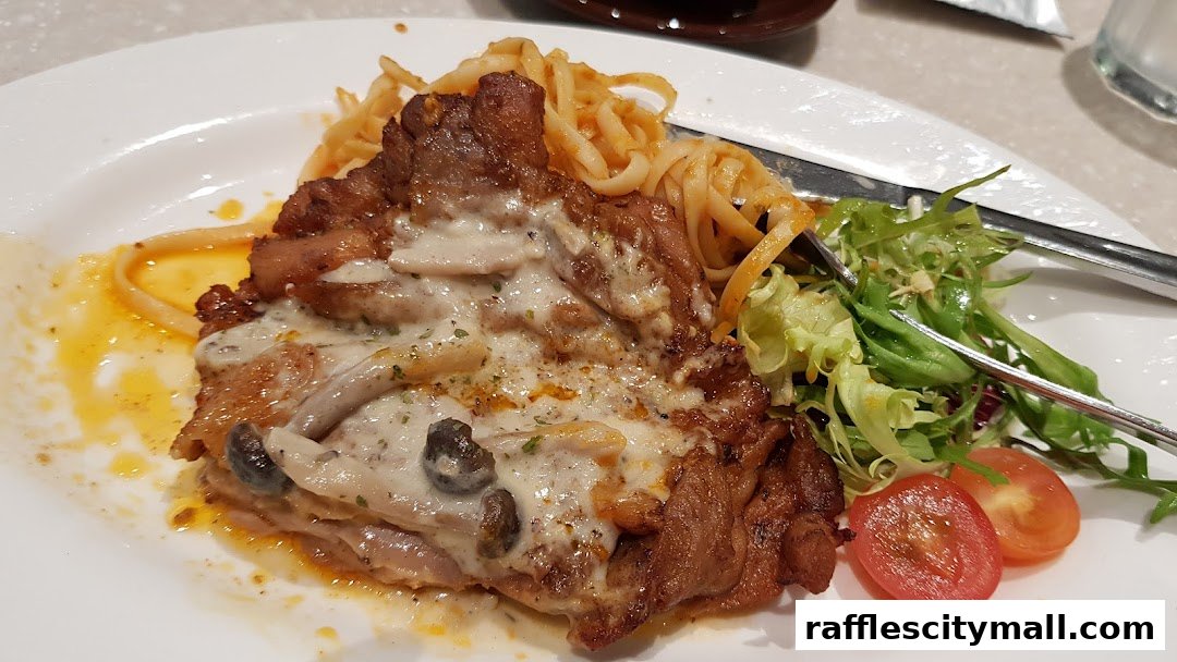 A plate of chicken with creamy mushroom sauce, pasta, and a side salad.