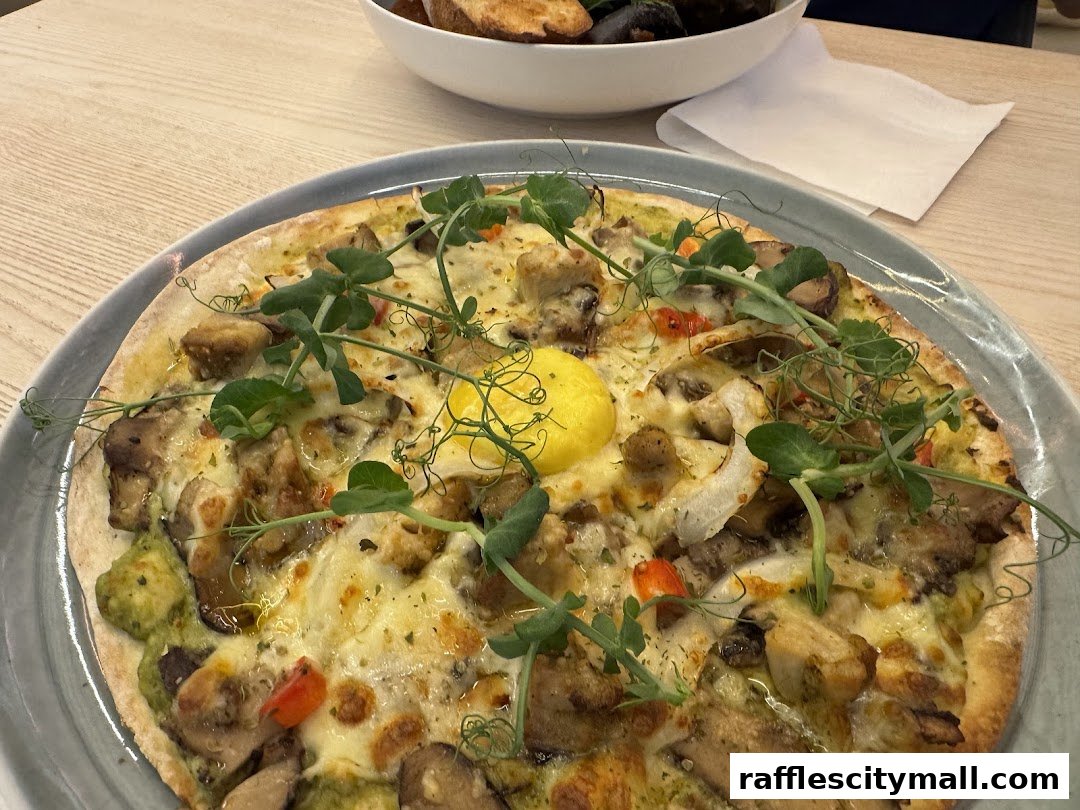 A close-up of a delicious pizza topped with chicken, mushrooms, and a sunny-side-up egg.