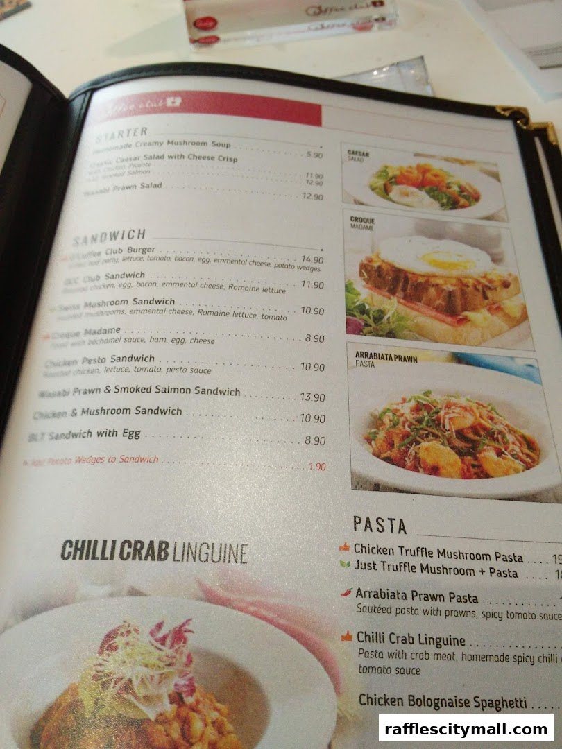 A menu from OCoffee Club Raffles City featuring starters, sandwiches, and pasta dishes.
