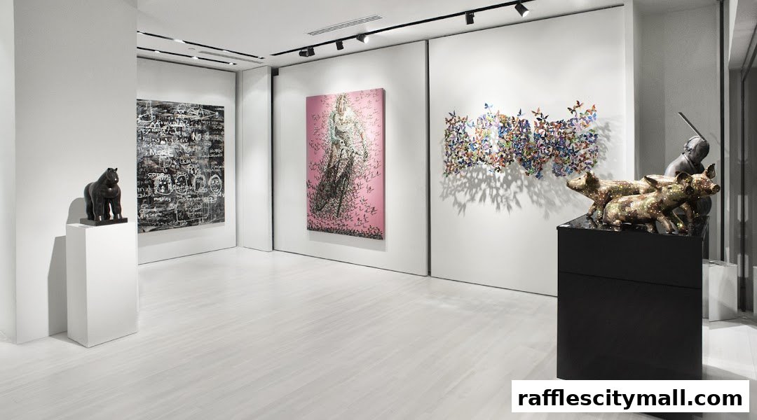 Interior view of an art gallery showcasing diverse sculptures and paintings.