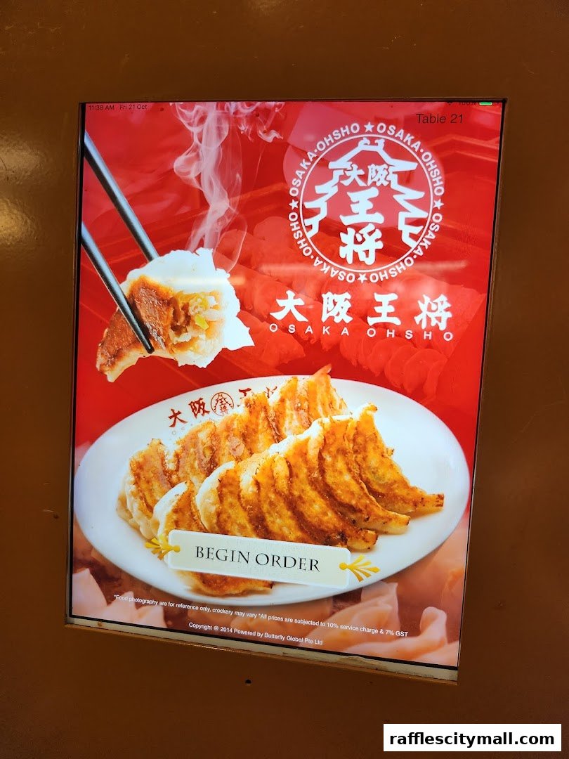 A digital menu board displaying delicious gyoza from Osaka Ohsho.