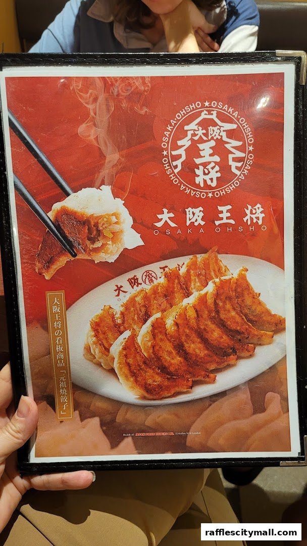A menu from Osaka Ohsho featuring a close-up of pan-fried gyoza.
