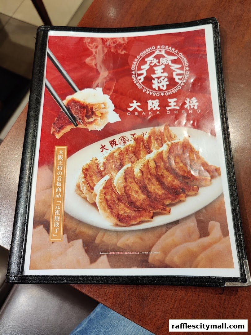 A menu from Osaka Ohsho featuring a close-up of pan-fried dumplings.