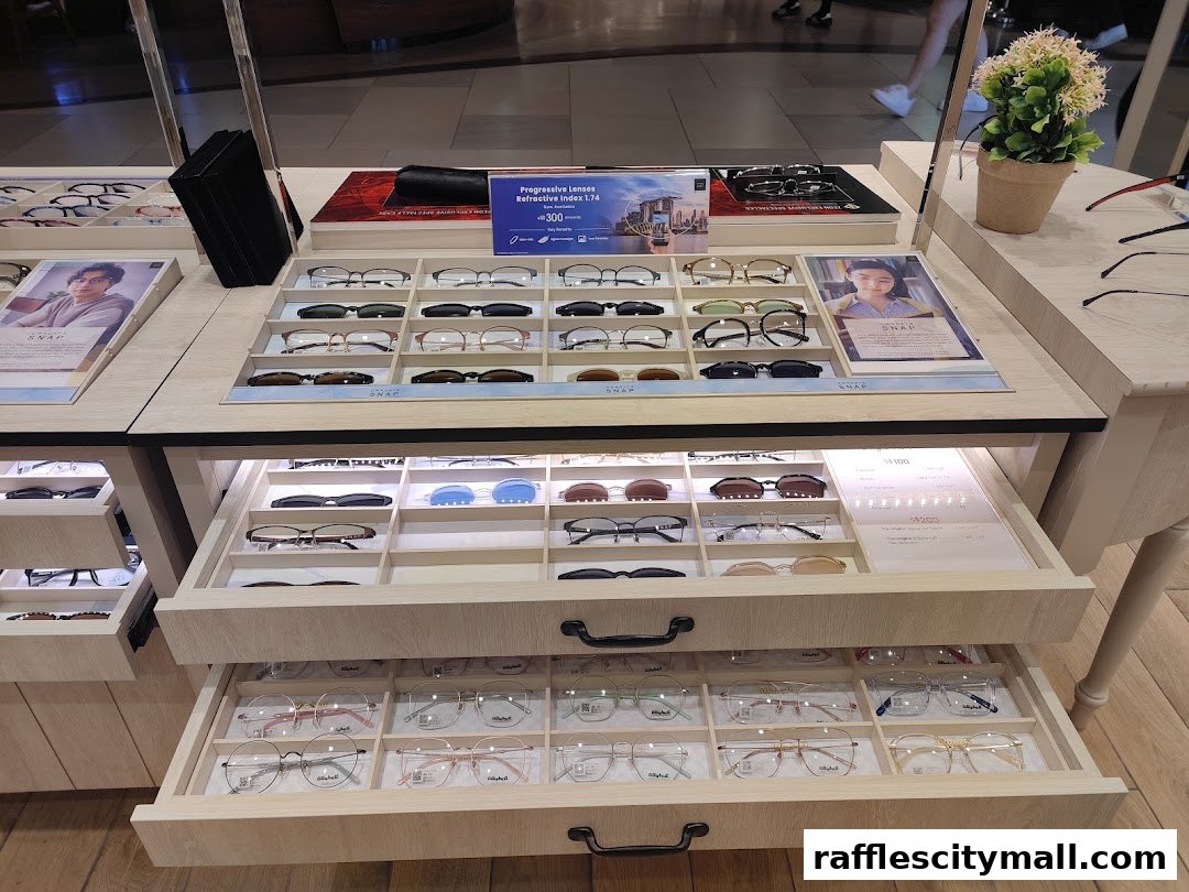 A display of various eyeglasses and frames neatly arranged in drawers and on shelves.