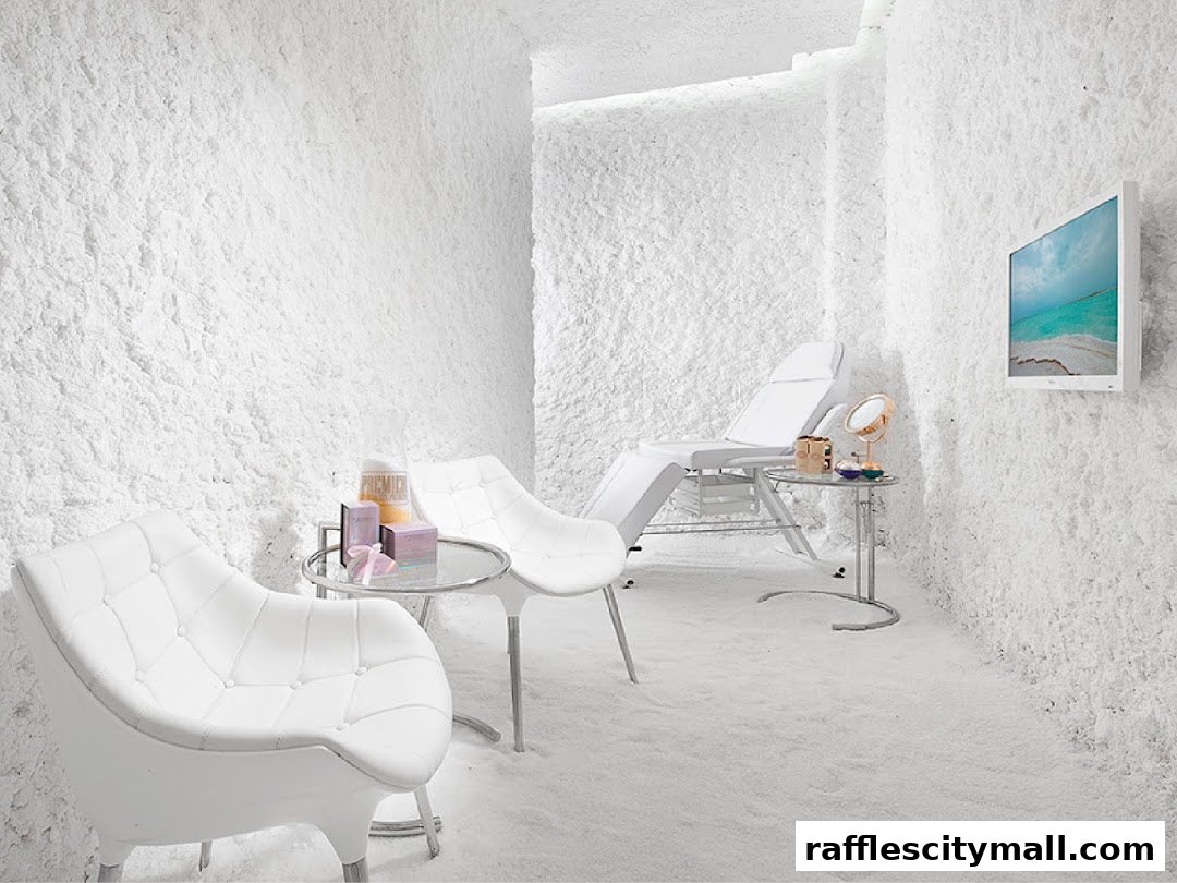 Interior of a salt room with chairs, a treatment bed, and a TV screen.