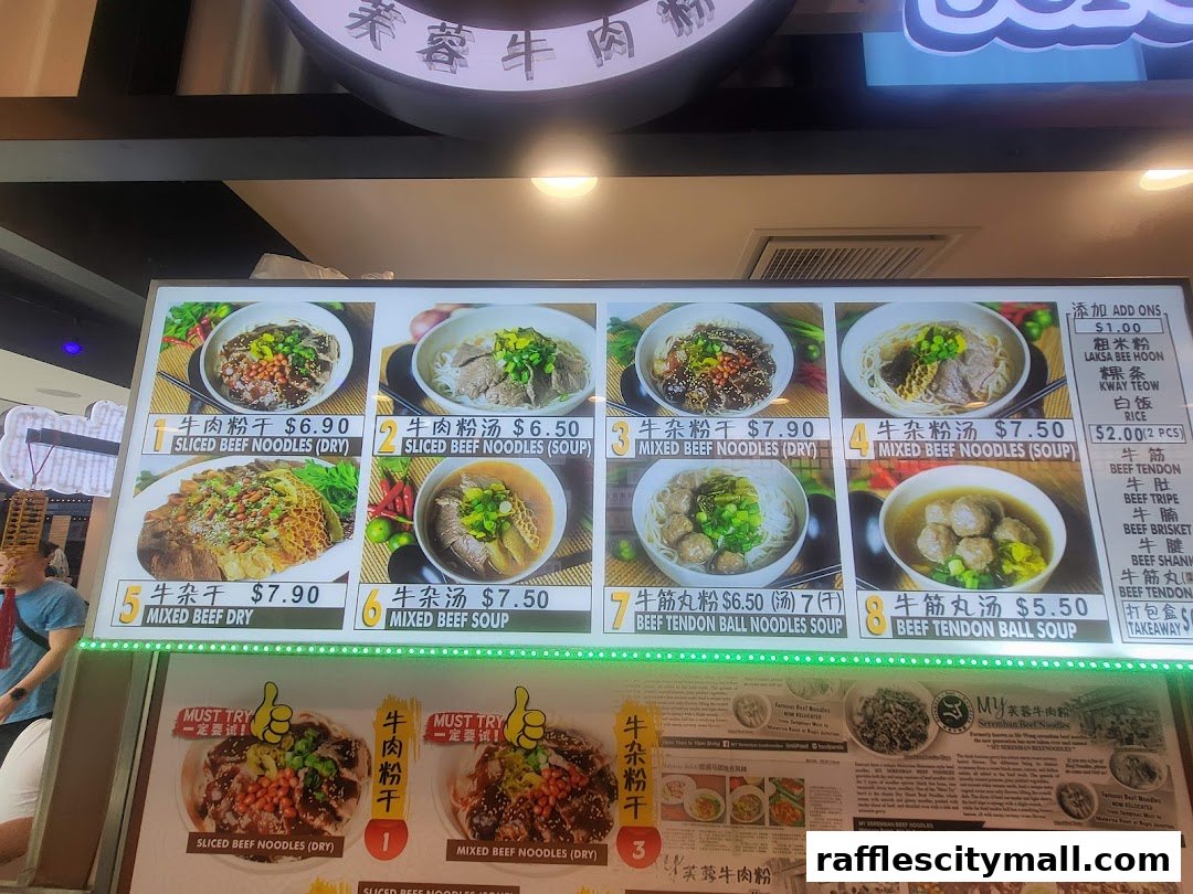 A brightly lit menu board showcasing various beef noodle dishes with prices and images.