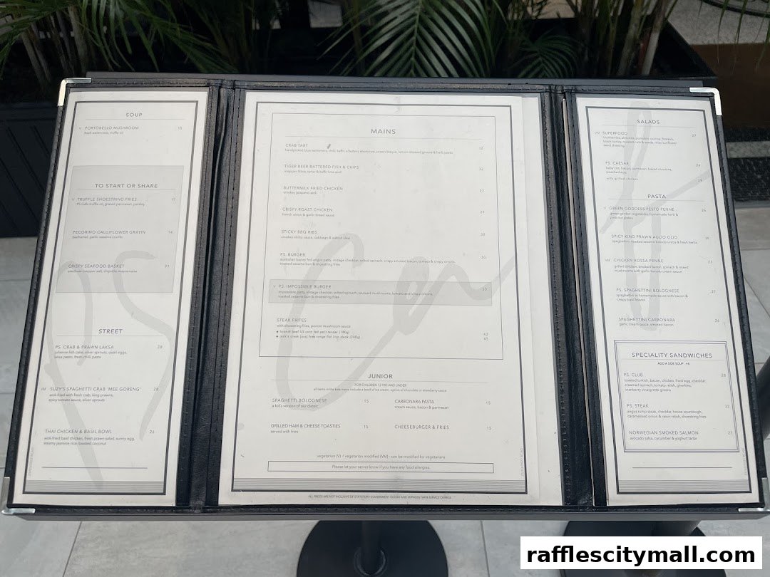 A menu from PS.Cafe Raffles City, featuring soups, mains, pasta, salads, and sandwiches.