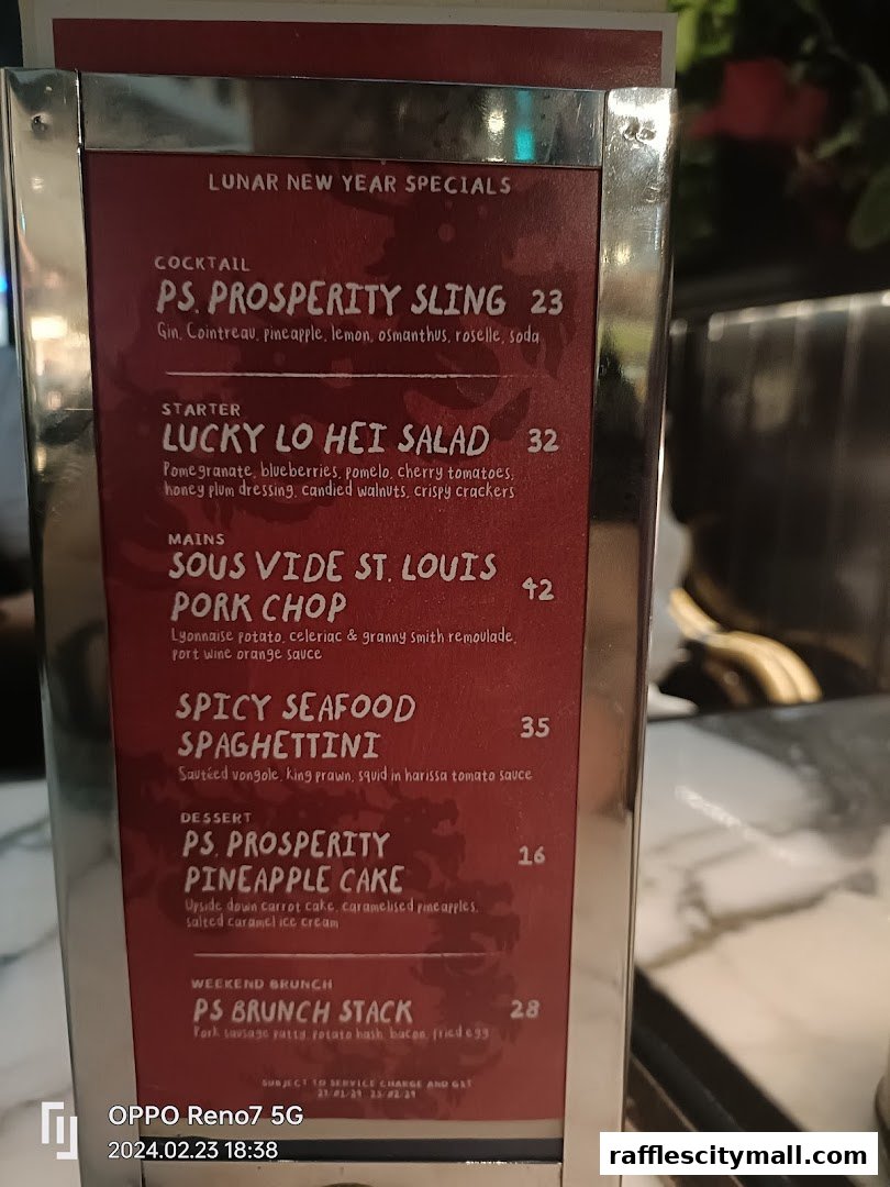 A menu board displaying Lunar New Year specials with various food and drink items.