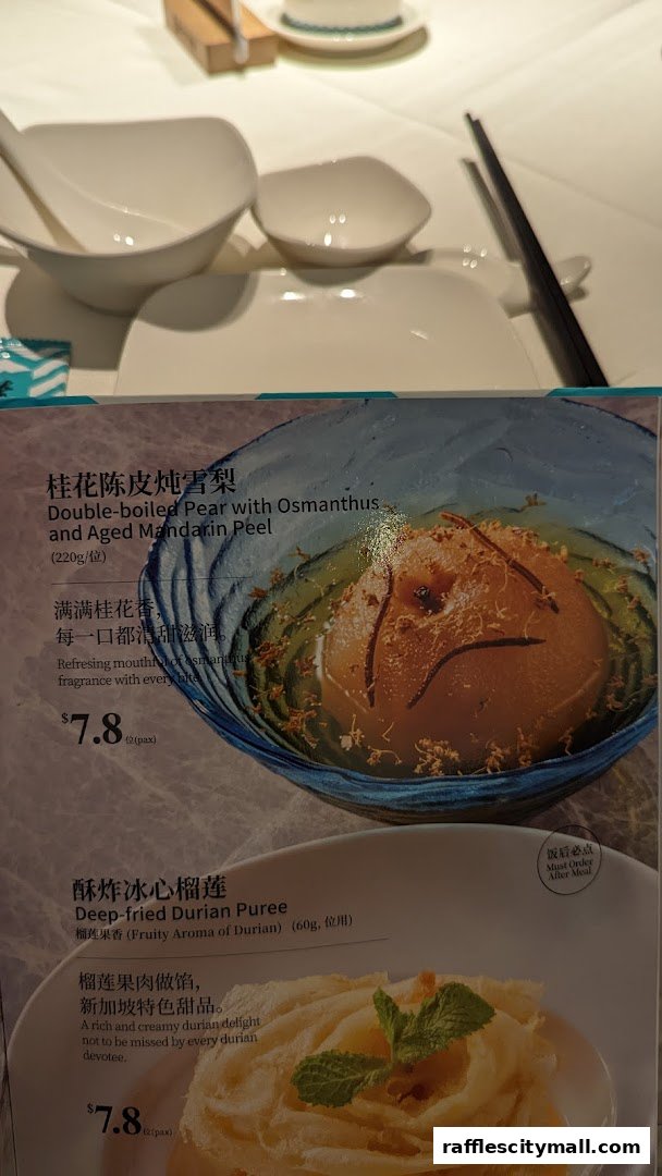 A menu showing two dessert dishes: double-boiled pear and deep-fried durian puree.