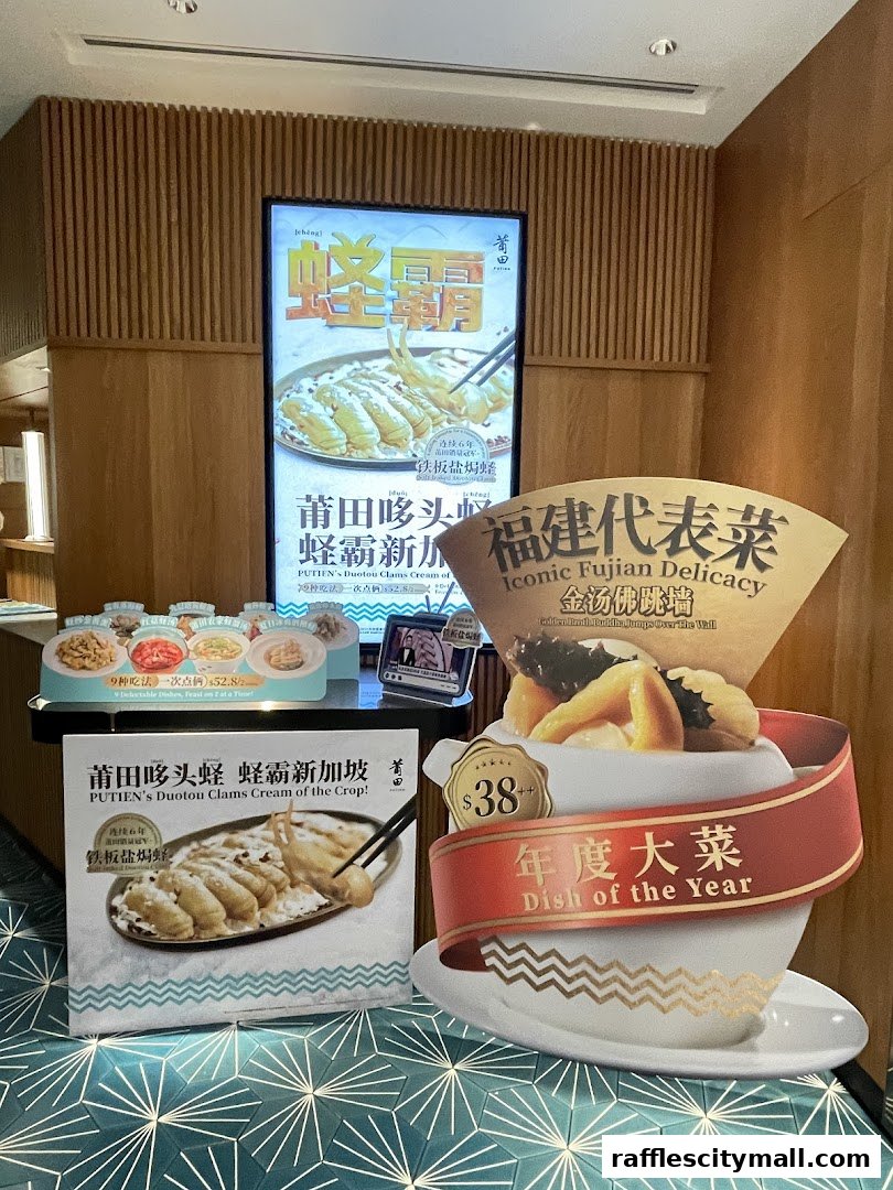 Promotional display for PUTIEN restaurant featuring signature dishes and a special offer.